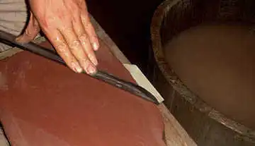 The Chinese swordsmith at work.